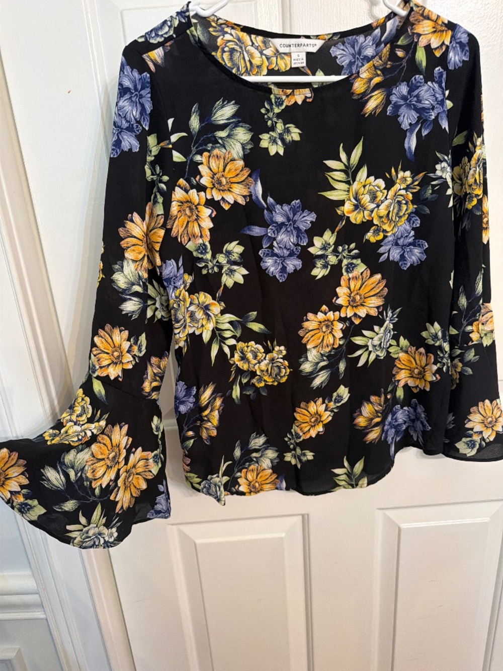 Black and floral design light weight top by Counterparts. Polyester, machine was